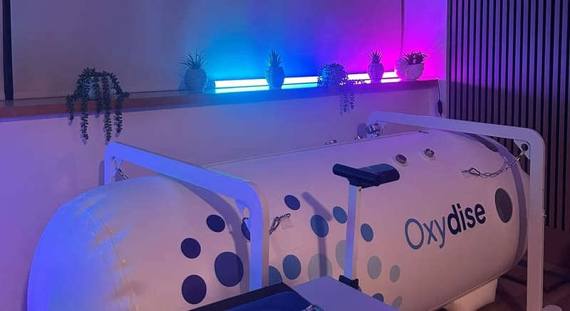 The hyperbaric chamber at the Green Oxygen Hyperbarics studio in Marlow, lit in blue and purple